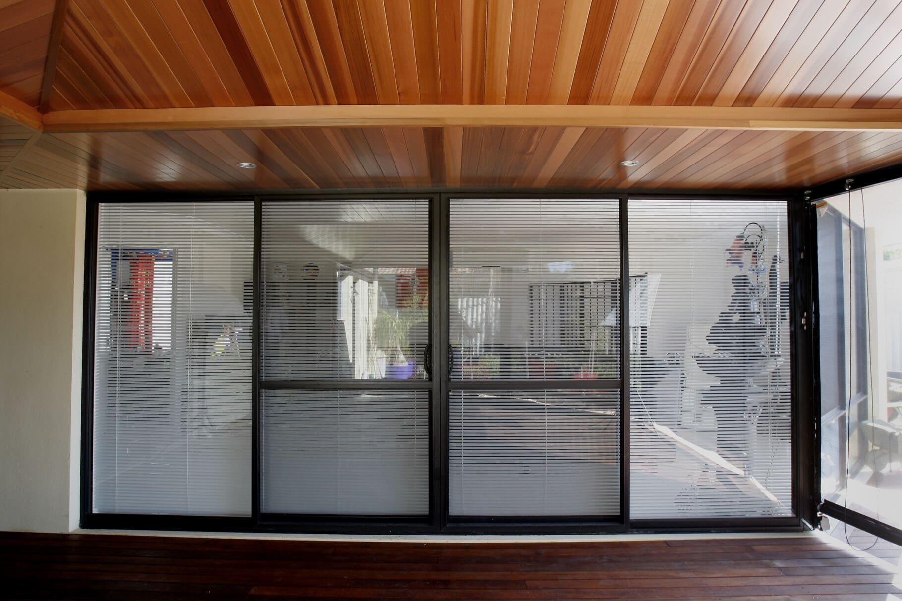 Four-pane sliding glass door with two side panels